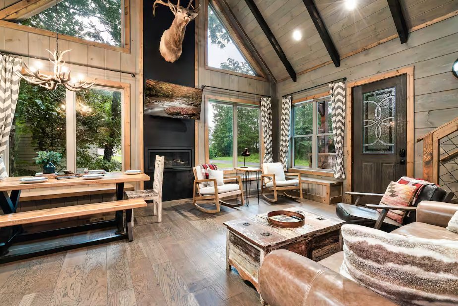 Cabin great room with wood beam ceiling cleaned for STR guests